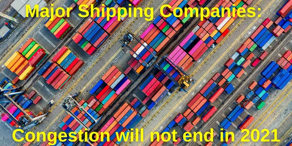 An aerial view of a warehouse filled with lots of shipping containers.