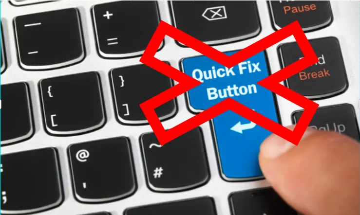 A person is pressing the quick fix button on a keyboard