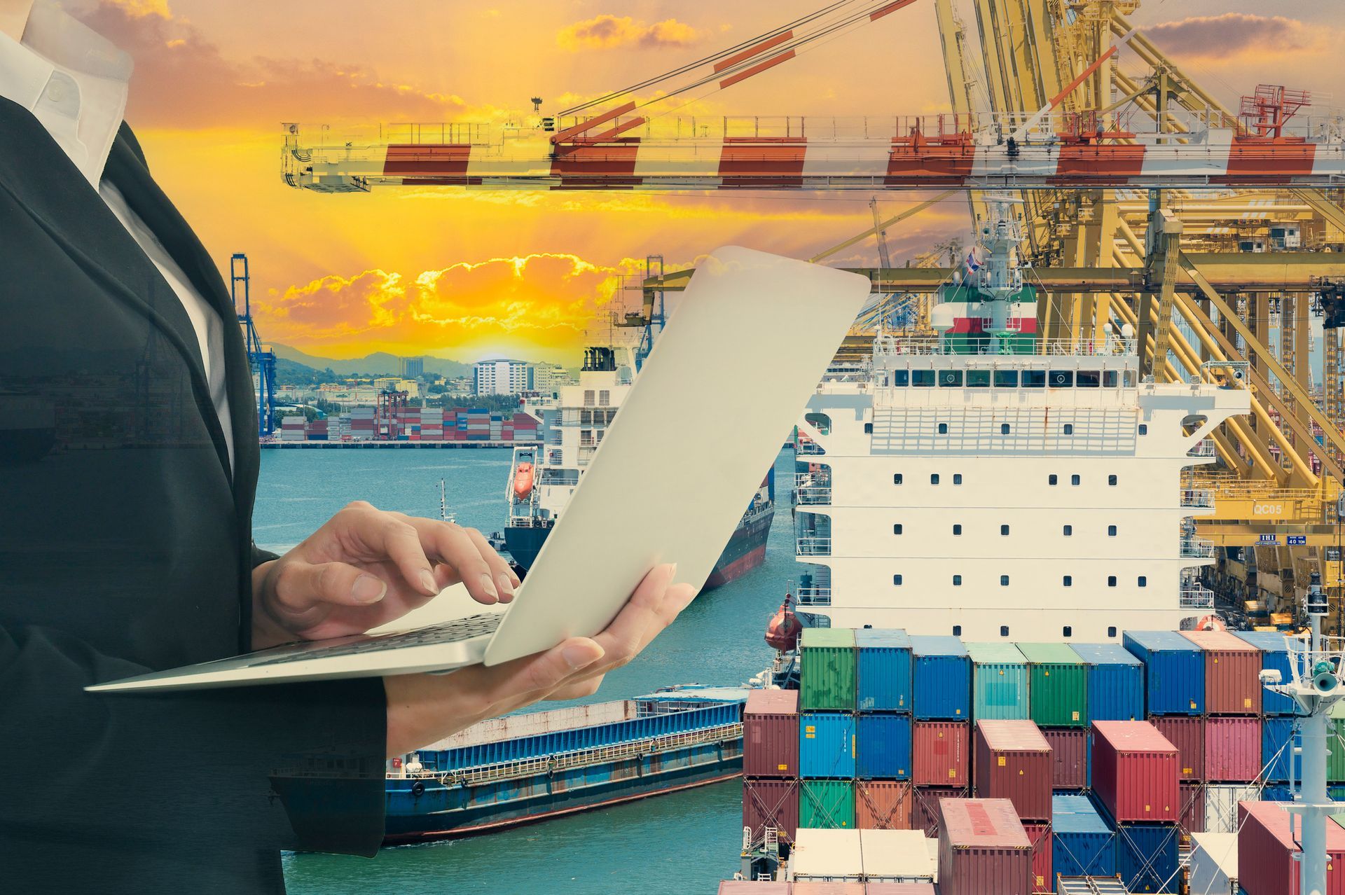 A man in a suit is holding a piece of paper in front of a large ship in a harbor.