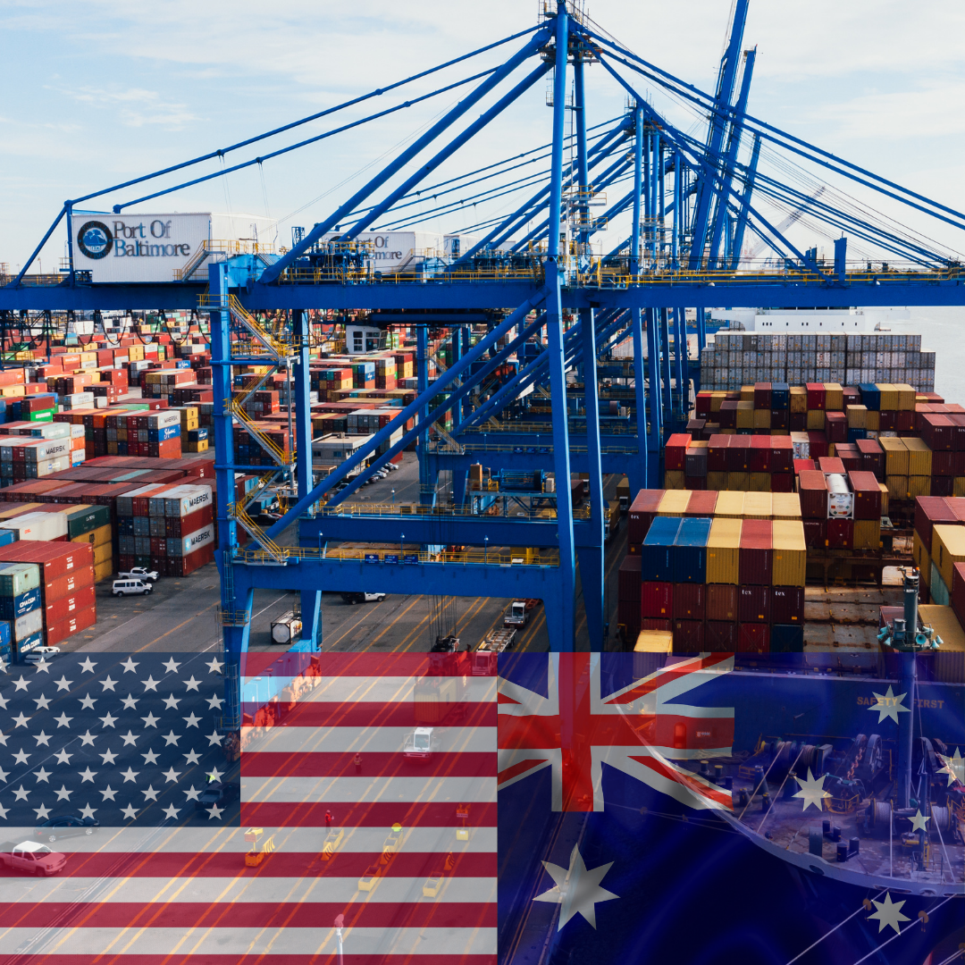 An aerial view of a container port with the flags of the united states and australia