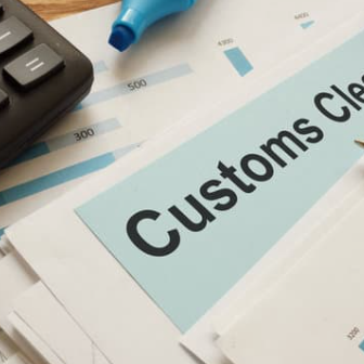 The word customs is on a piece of paper