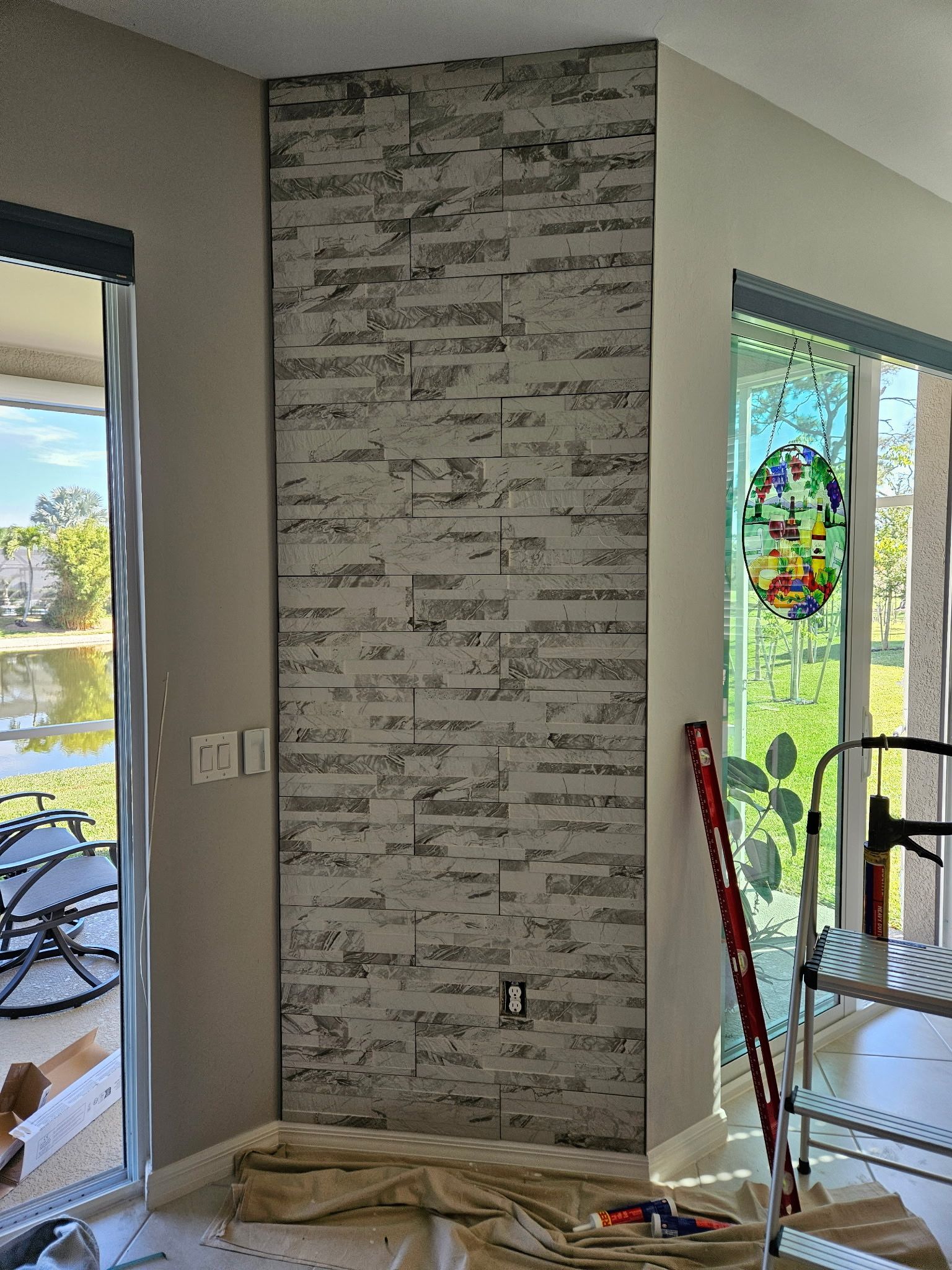 A corner wall with gray brick-like paneling