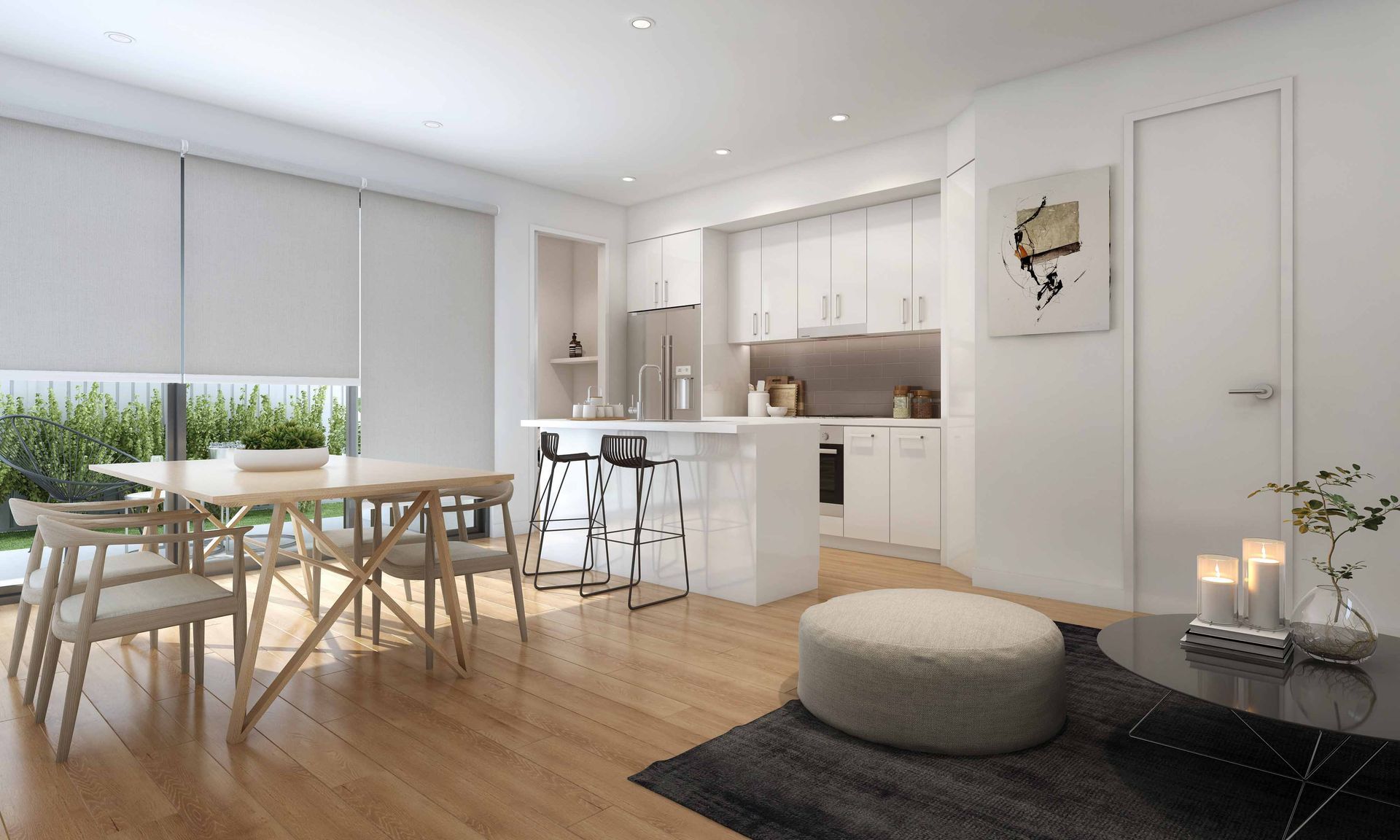 Modern white dining-living room with wood floors, round table, kitchen bar stools, and gray rug.