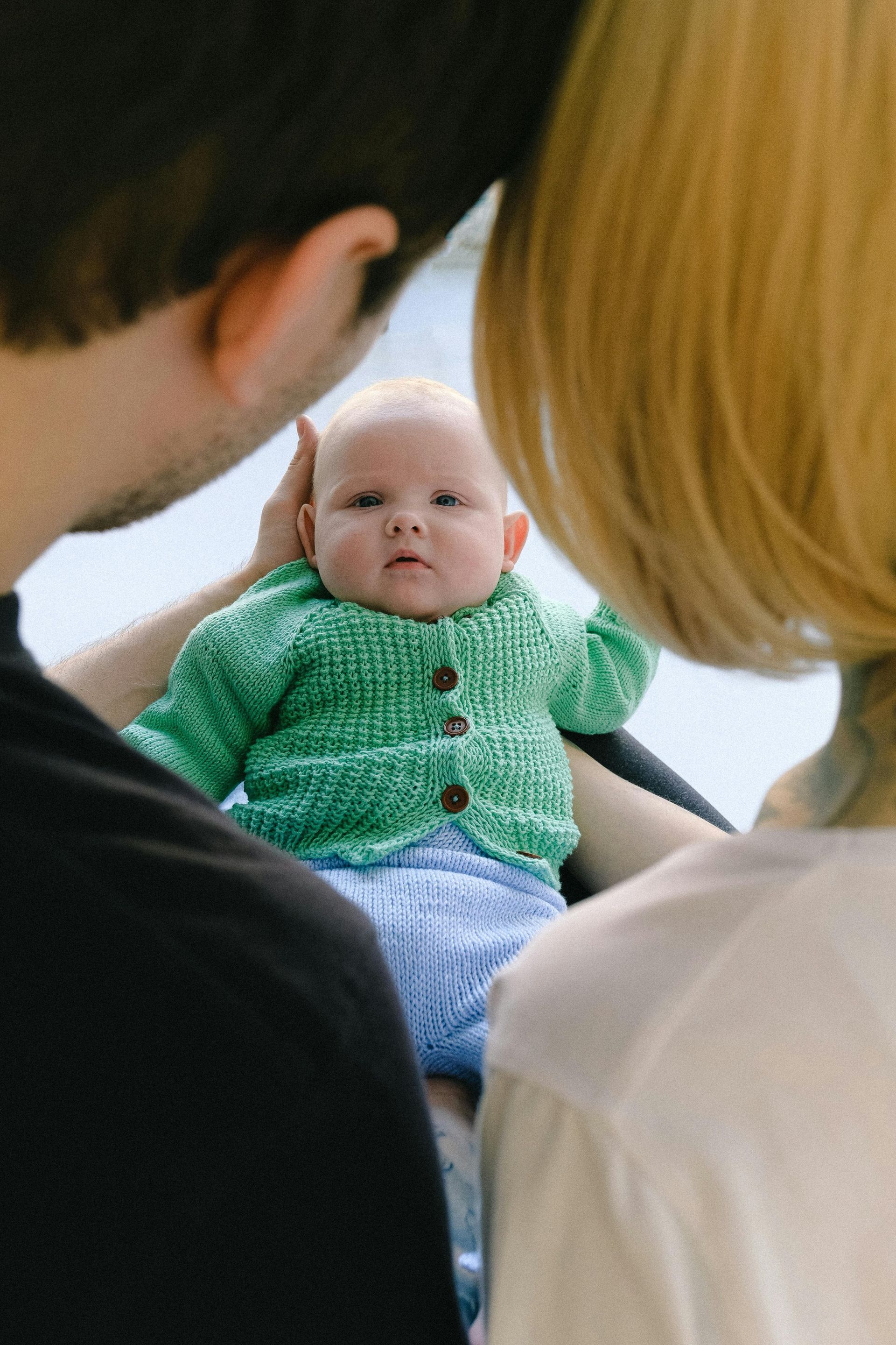 A couple holding a healthy baby