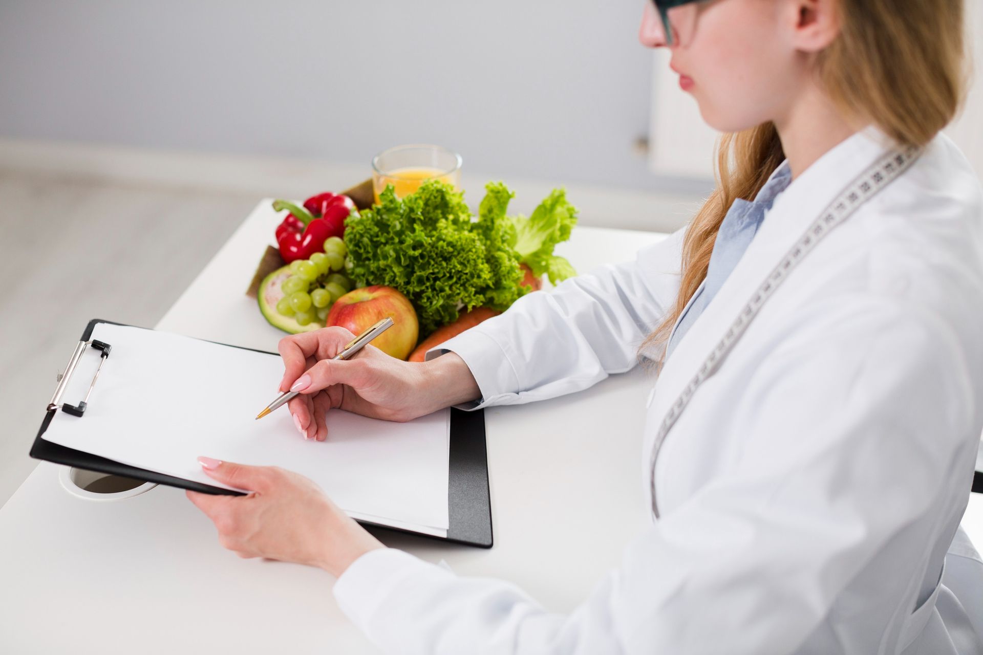 Nutritionist dietitian writing a meal plan
