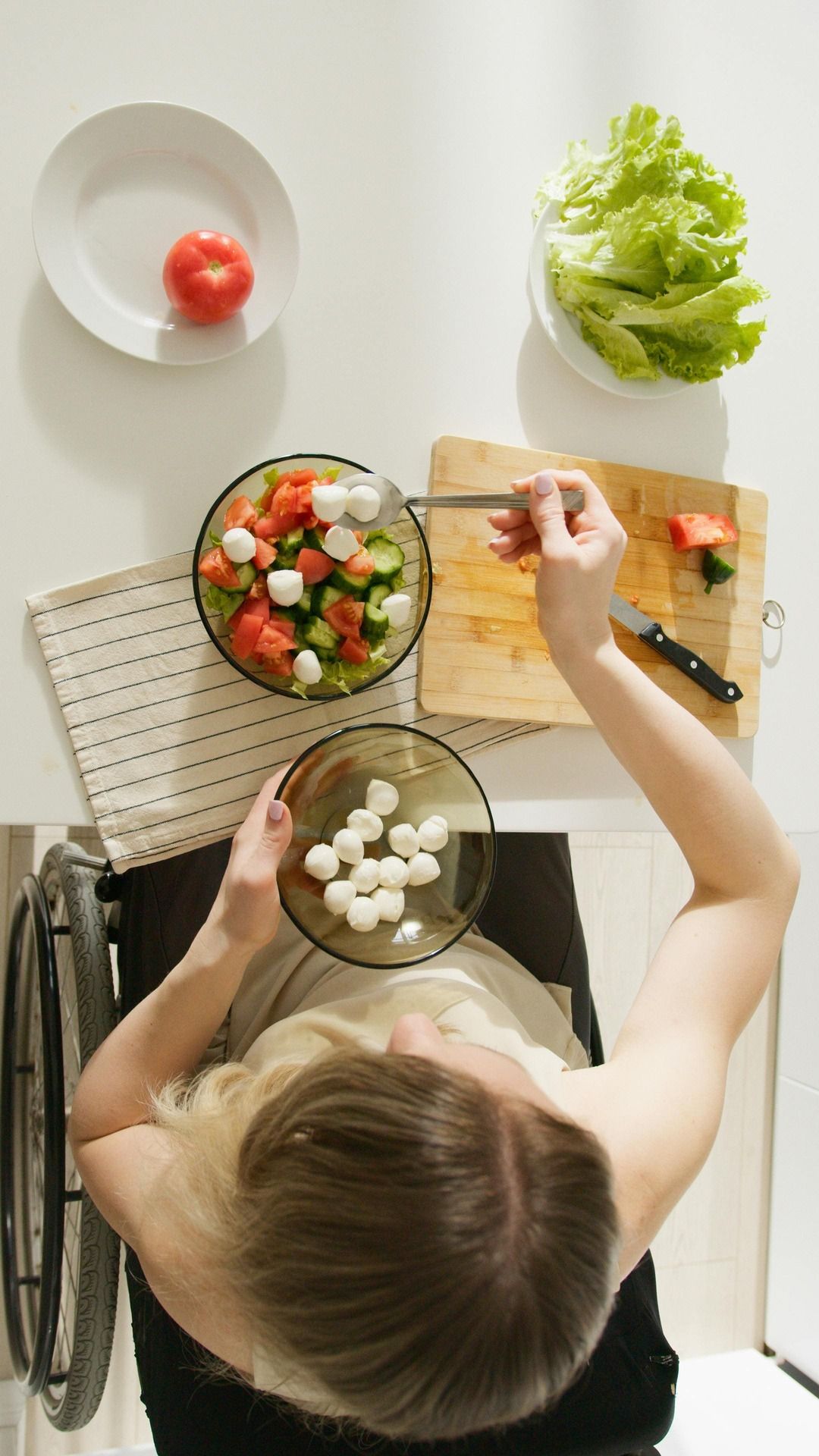 A woman preparing a healthy salad