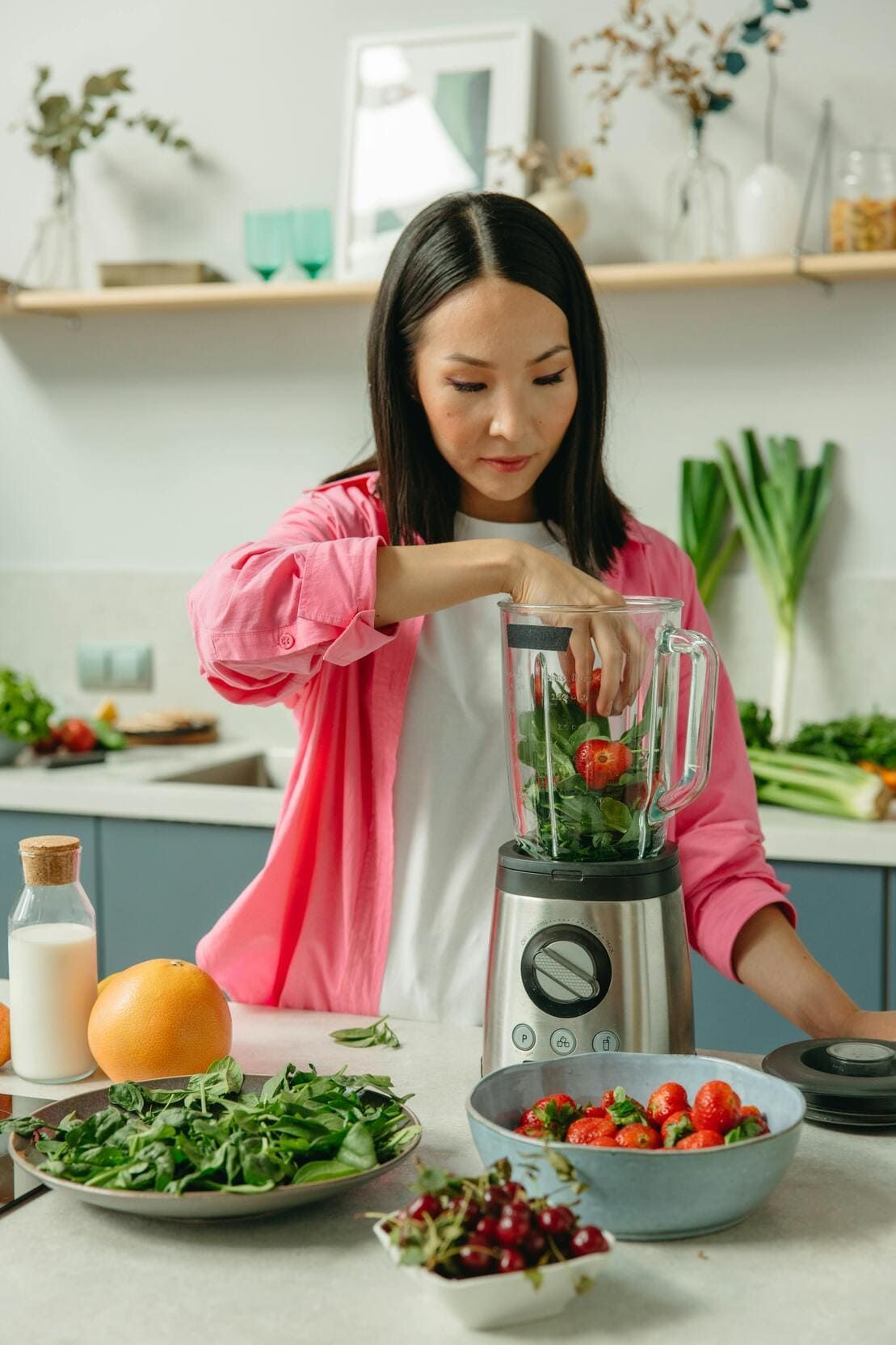 a woman preparing a nutritious shake
