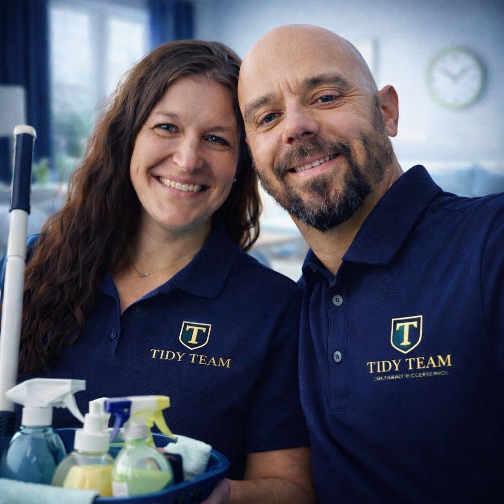 A person is cleaning a bathroom mirror with a duster.