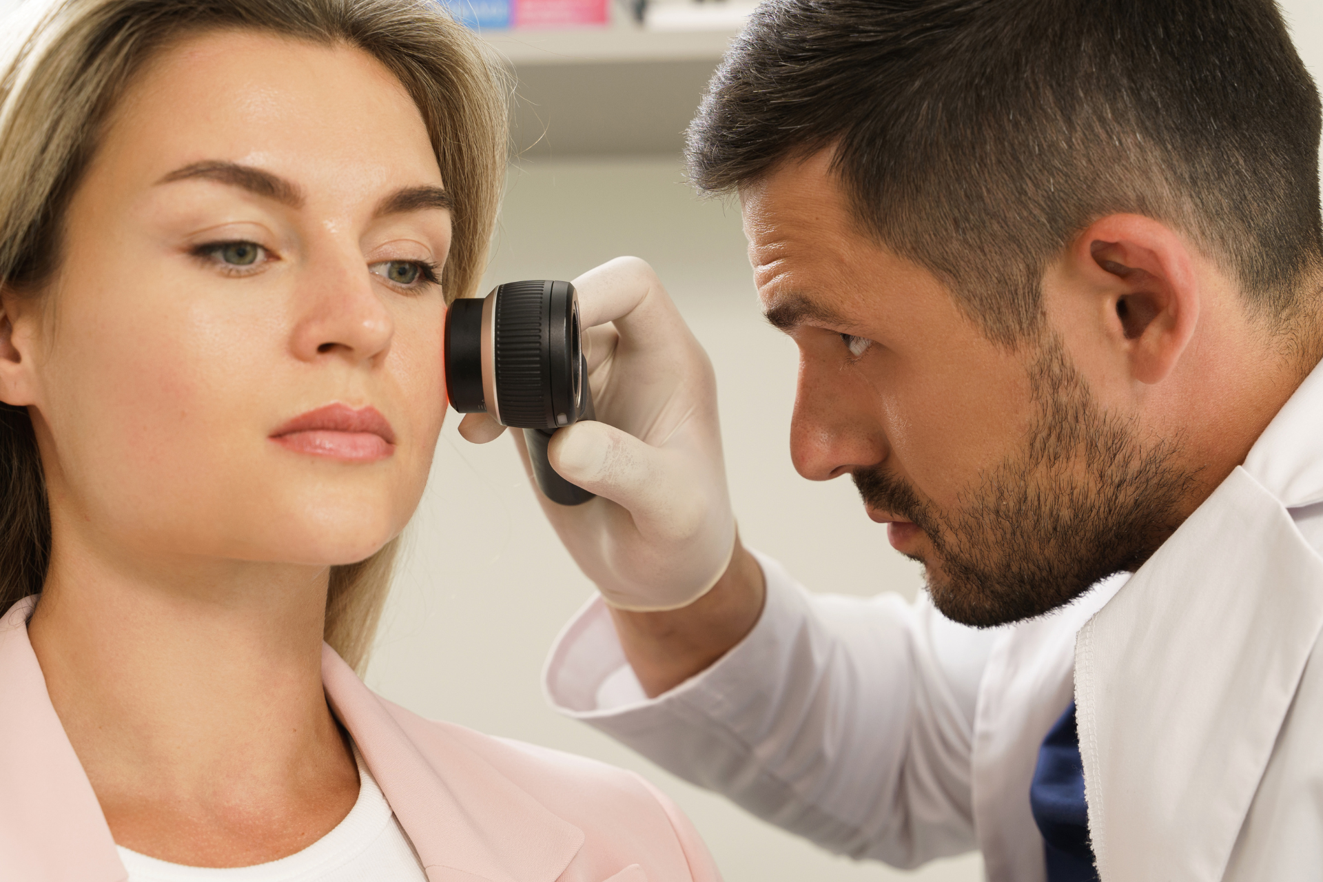 Dermatologist Is Using Dermatoscope for Facial Skin Examination