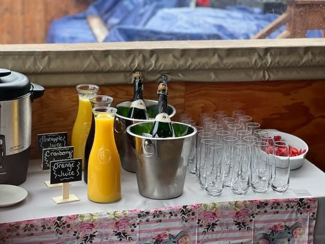 A patio with tables and chairs and umbrellas on a sunny day.