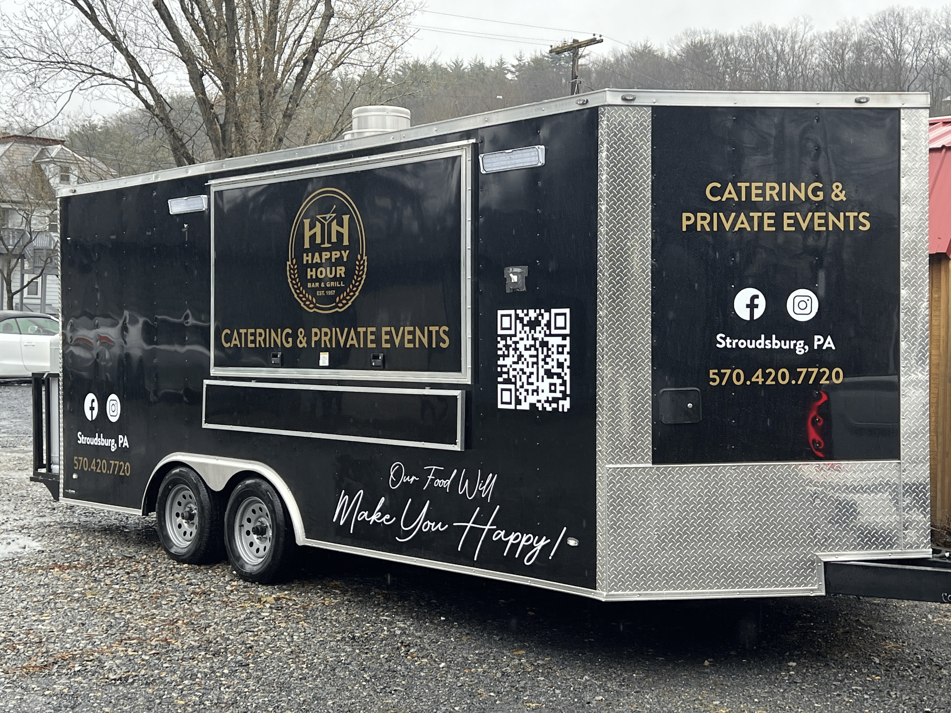Happy Hour Bar & Grill food truck is parked in a parking lot.