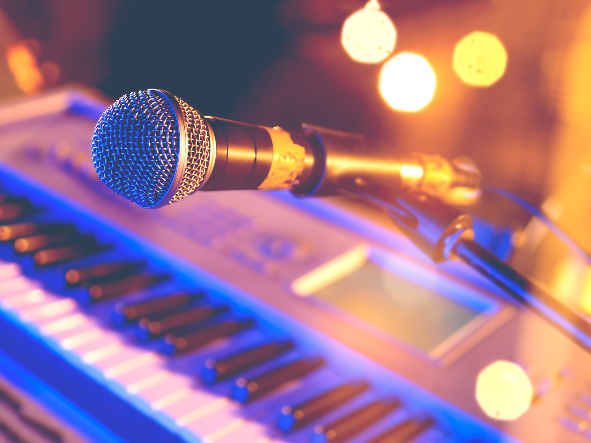 A patio with tables and chairs and umbrellas on a sunny day.