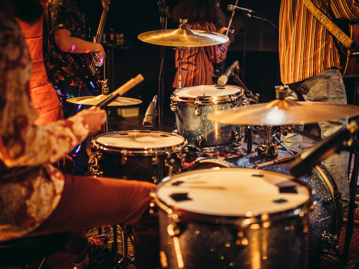 A restaurant with tables and chairs on a wooden deck.