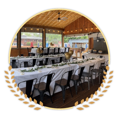 A large room with tables and chairs set up for a wedding reception at Happy Hour Bar & Grill
