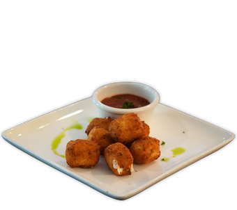 A bowl of soup with bread and a spoon on a plate from Happy Hour Bar & Grill