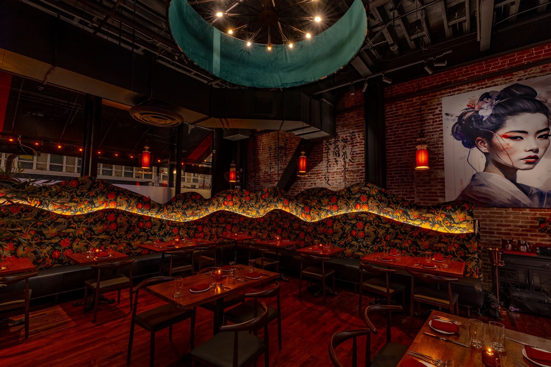 A restaurant with tables and chairs and a painting of a geisha on the wall.