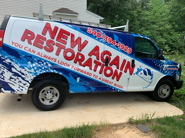 A new restoration van is parked in a driveway