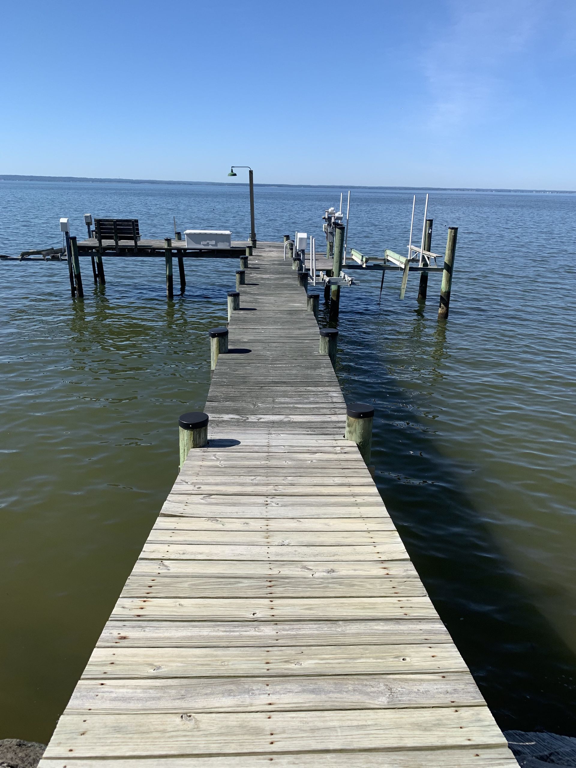 A wooden dock leading into a body of water