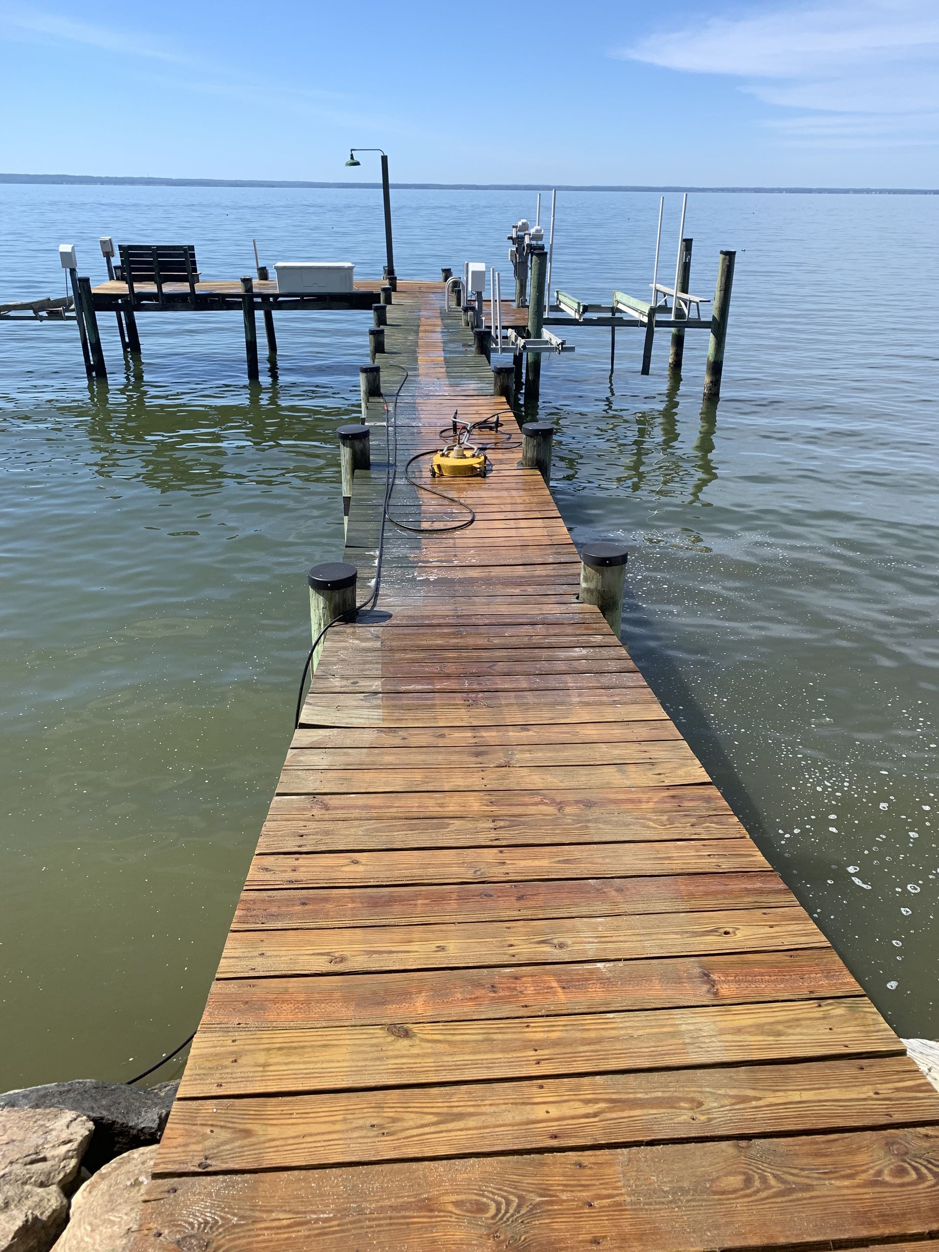 A wooden dock leading into a body of water.
