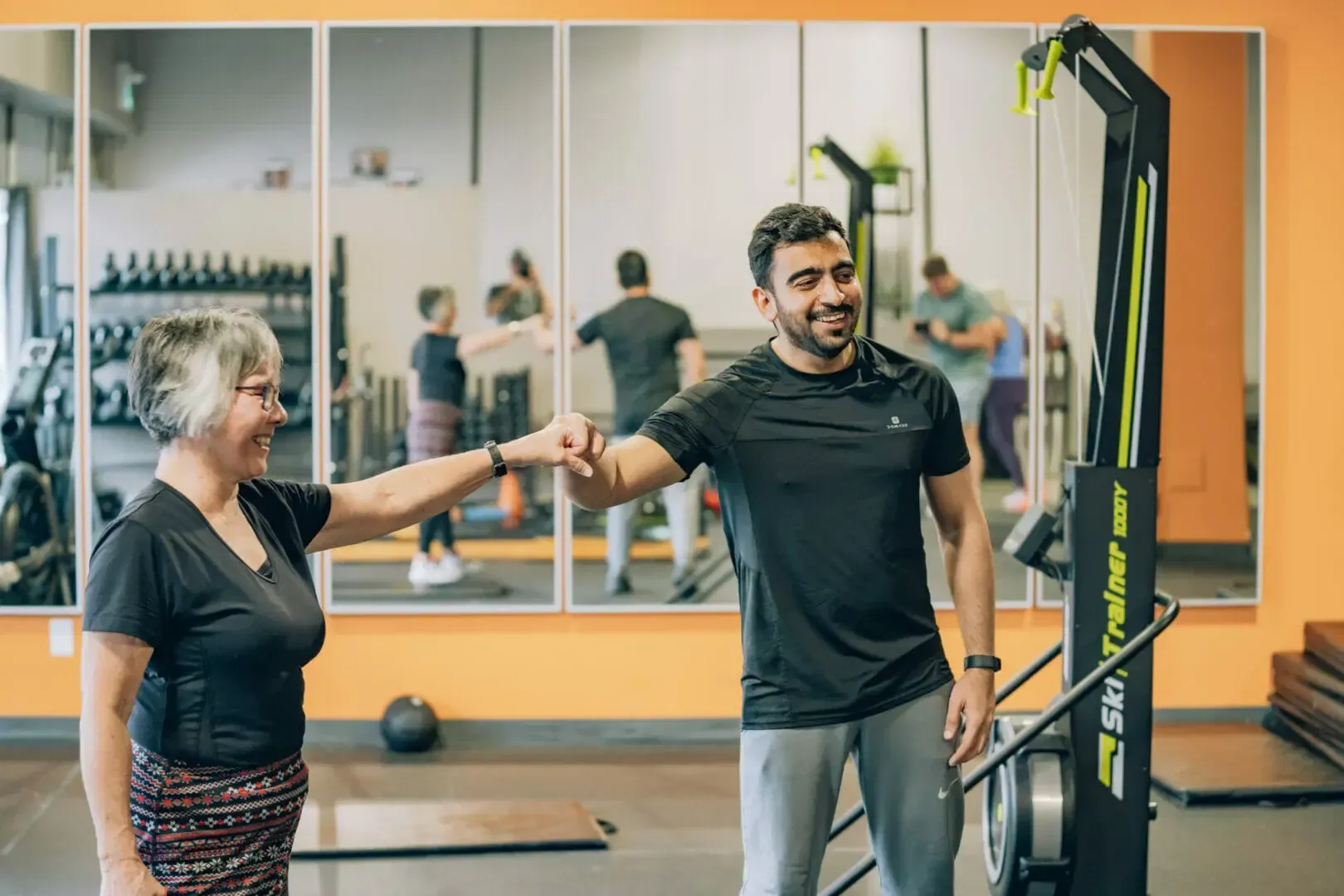 A black and white photo of a woman talking on a cell phone.
