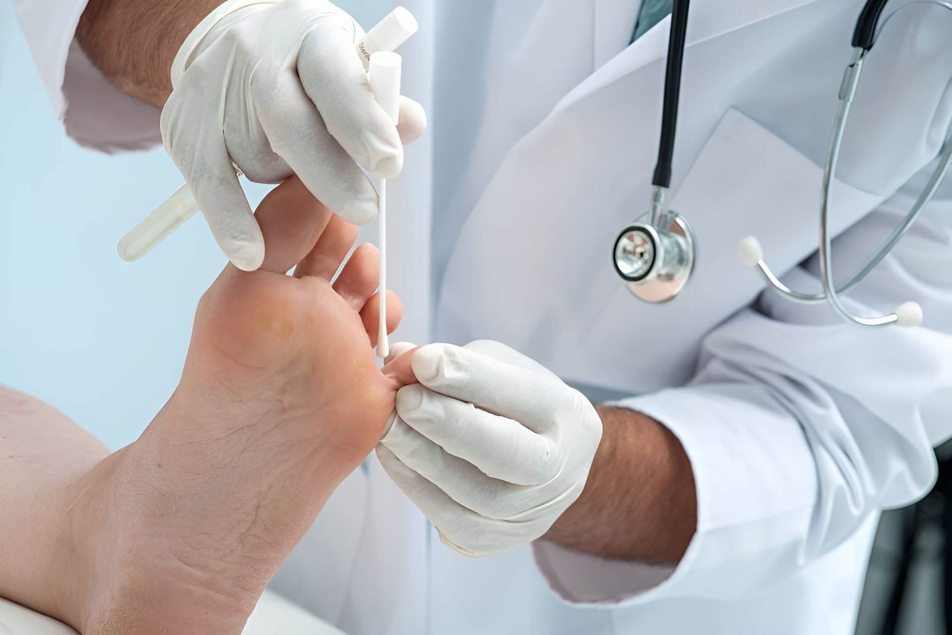 A Doctor Is Examining A Patient's Foot — Hastings Podiatry Centre In Port Macquarie, NSW