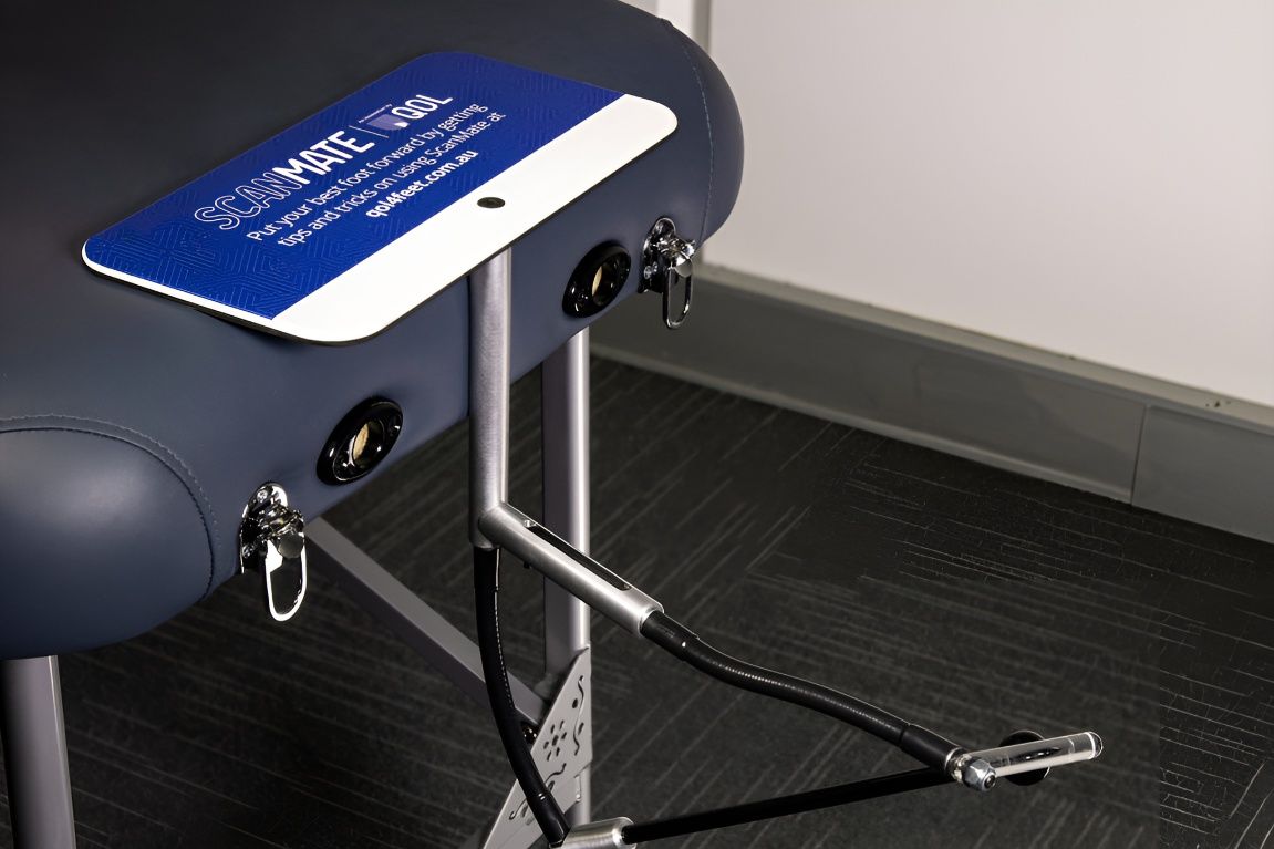 A Massage Table With a Blue and White Tray on It — Hastings Podiatry Centre In Port Macquarie, NSW