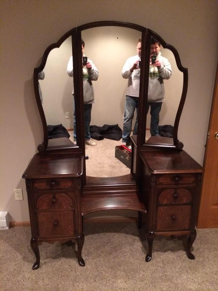 A man is taking a picture of himself in a mirror