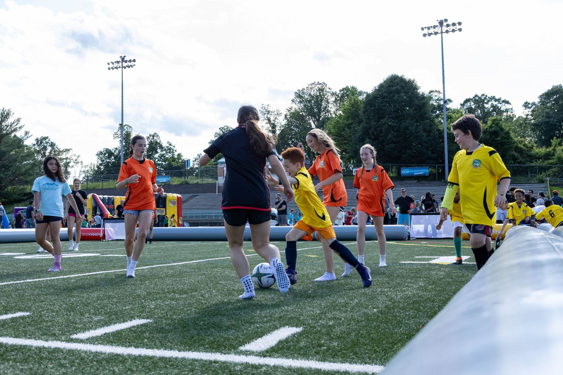 MSI kids playing in Airpitches during the Soccerfest event.