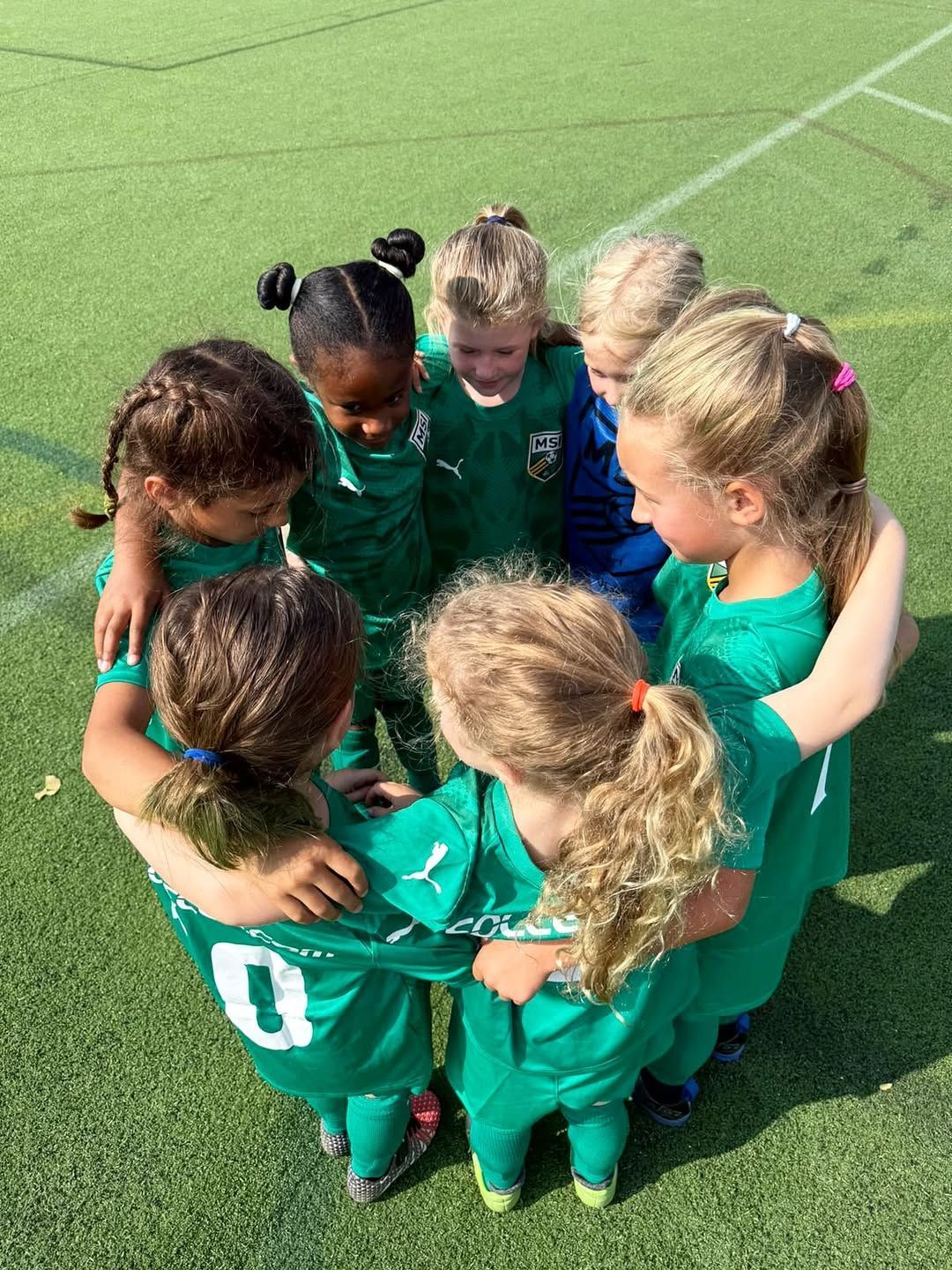 MSI travel players huddling before a game.