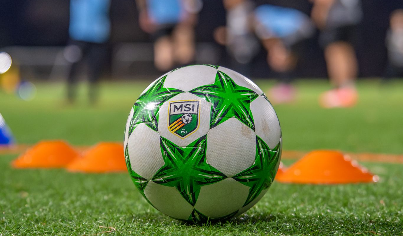 A MSI soccer ball in front of a set of cones during an MSI travel practice.