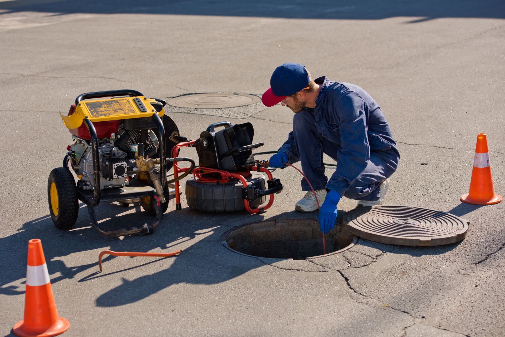 A man is working on a sewer tank