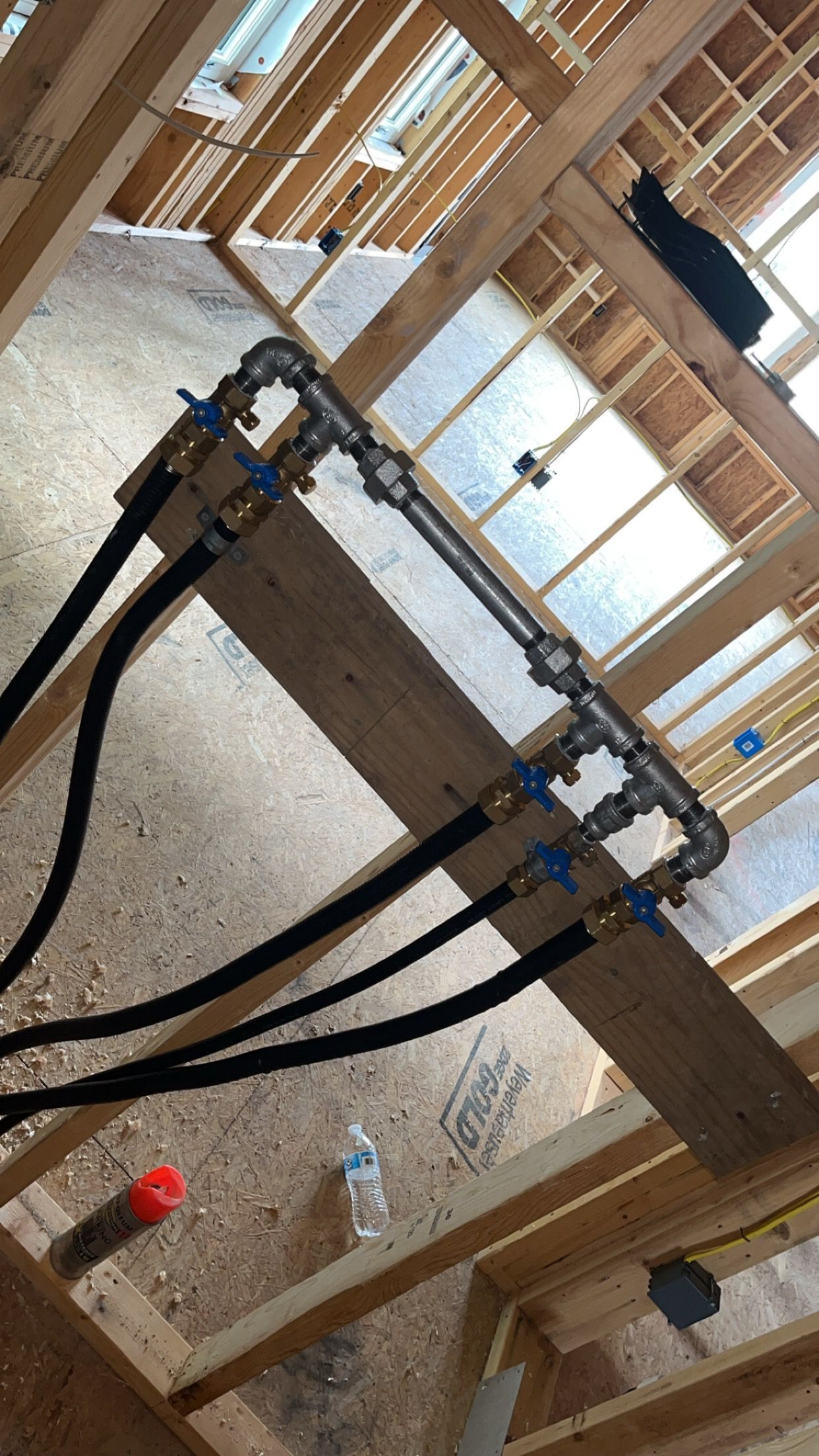 Family gathered at a dining table in a kitchen. They are eating and talking together.