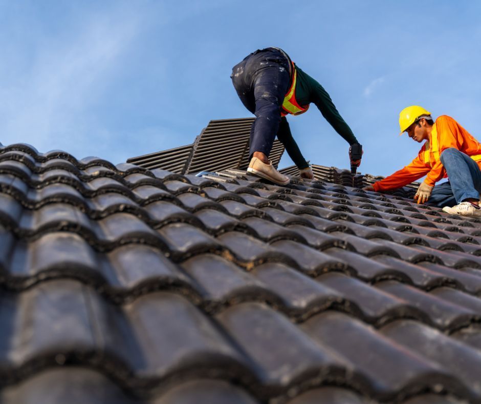 roofing professionals installing roof tiles