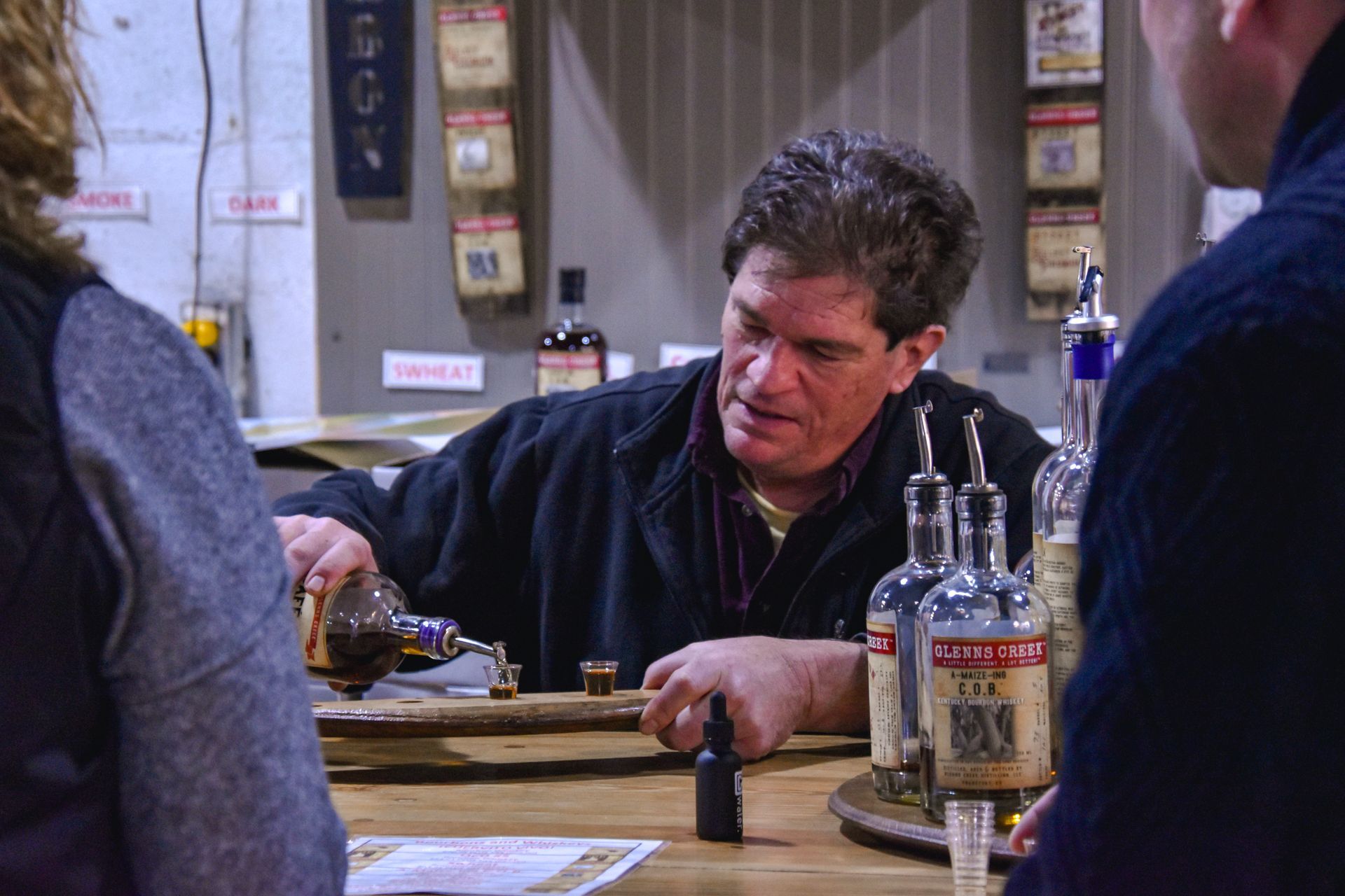 Unique Glenns Creek Distilling bartender pouring a drink