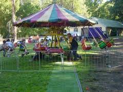 A carousel with children riding on it