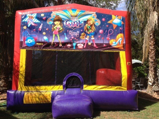 Girls-themed inflatable bounce house; red, yellow, and purple with girls' cartoon characters and decorative elements.