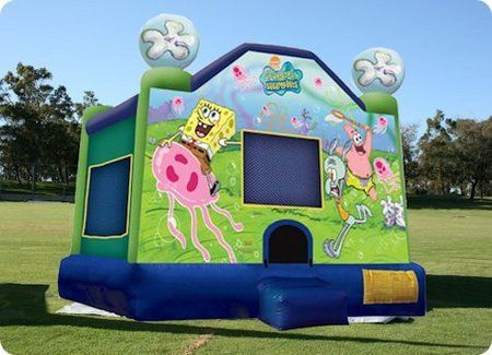 SpongeBob SquarePants inflatable bounce house. Green and blue with SpongeBob, Patrick, and jellyfish on a sunny lawn.