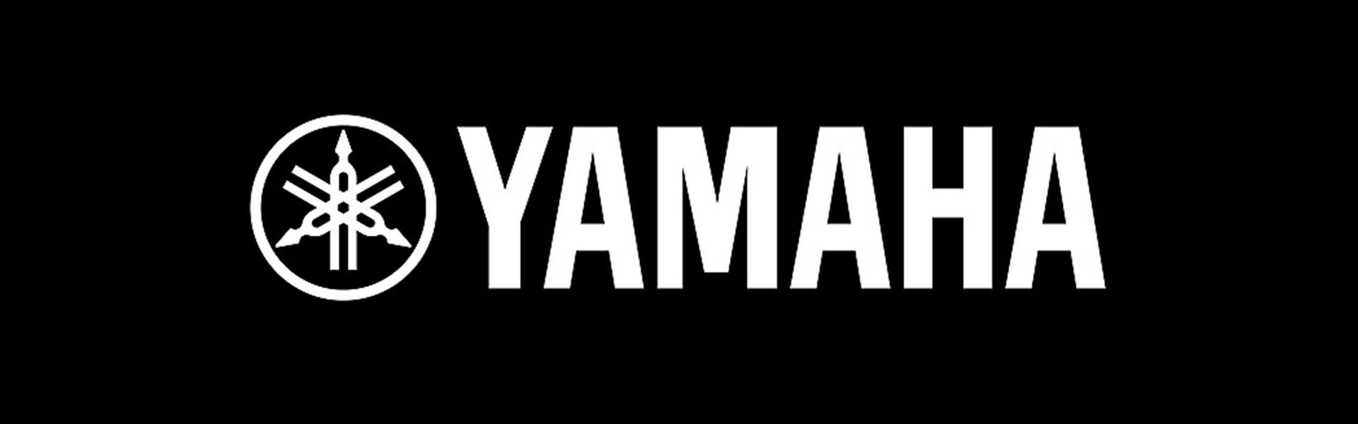 Yamaha logo with a white emblem and text on a black background.