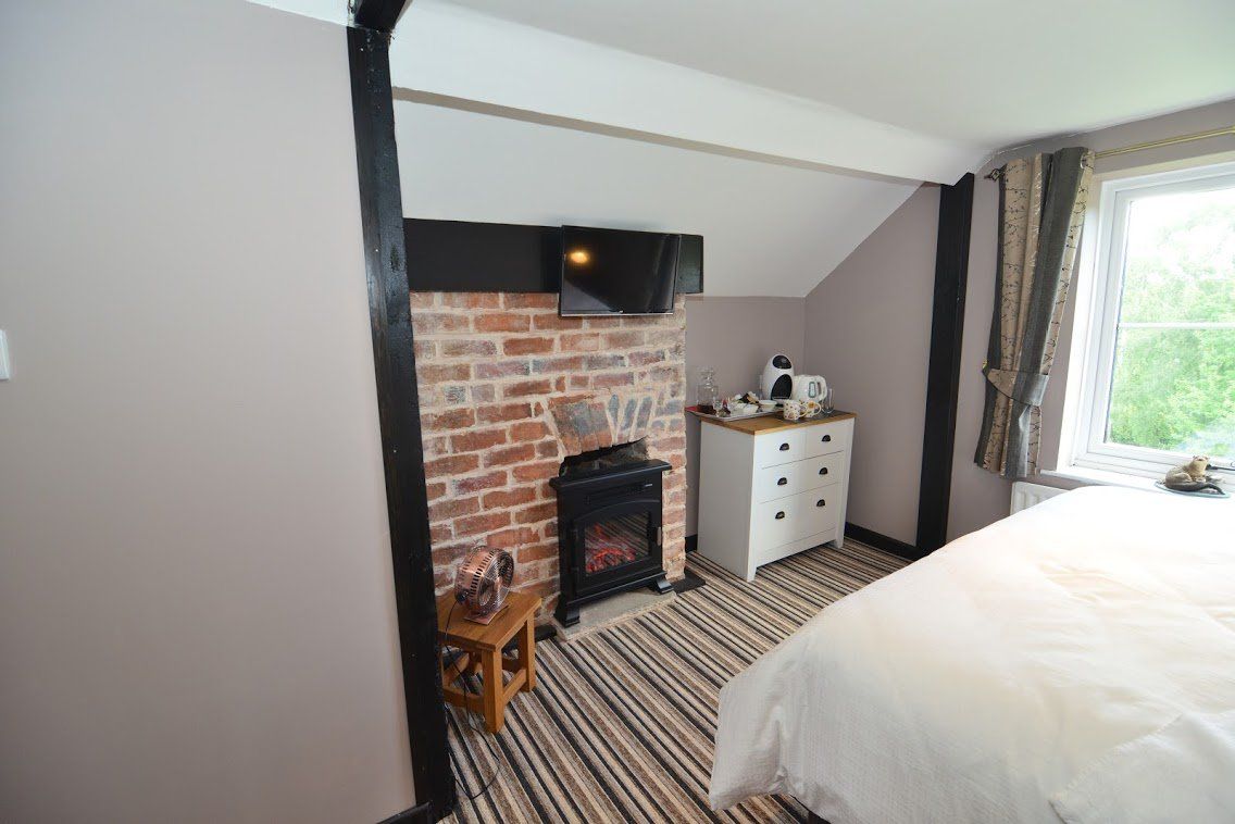 white room with brick wall