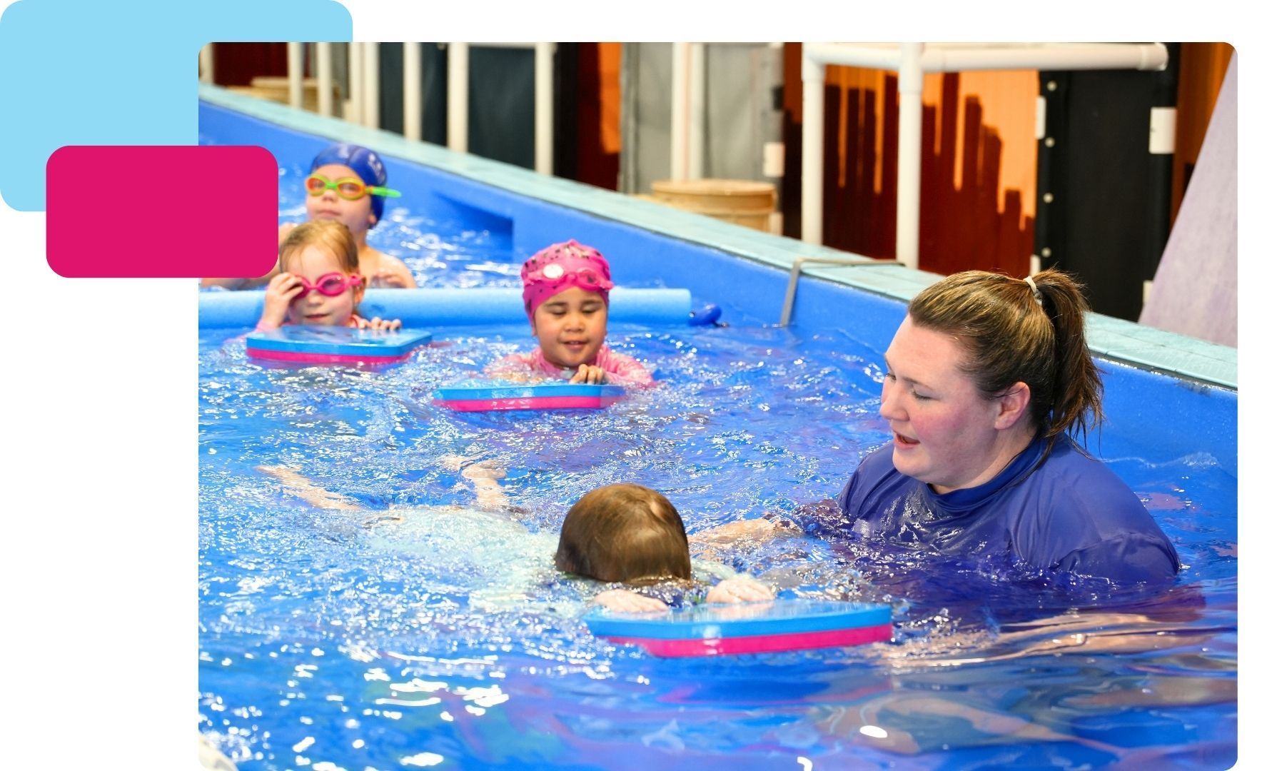 Swim instructor helping kids with kicking and floating in the pool - Fulton Swim School
