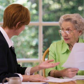 Supervised Estates — Old Woman Consulting an Attorney in Lapeer, MI
