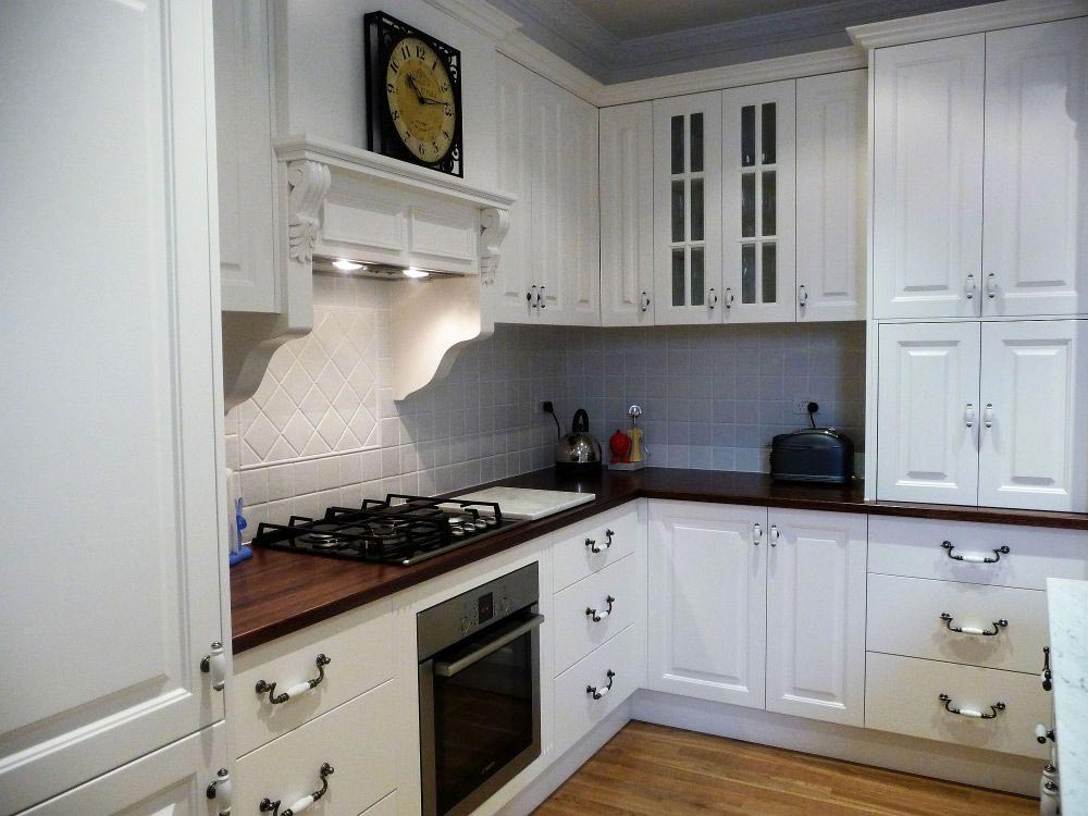 stove with white drawers