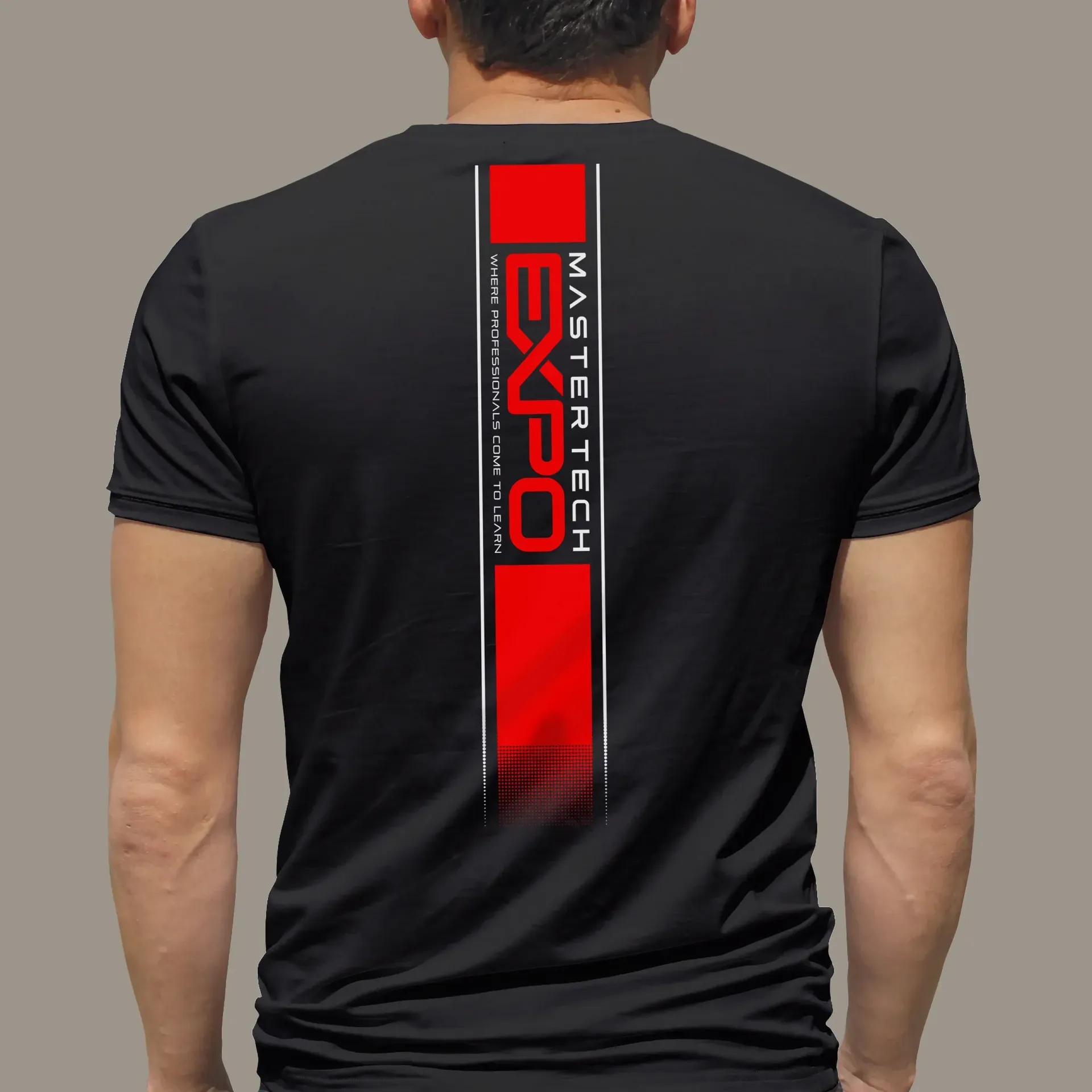 Man wearing a black t-shirt with a red 