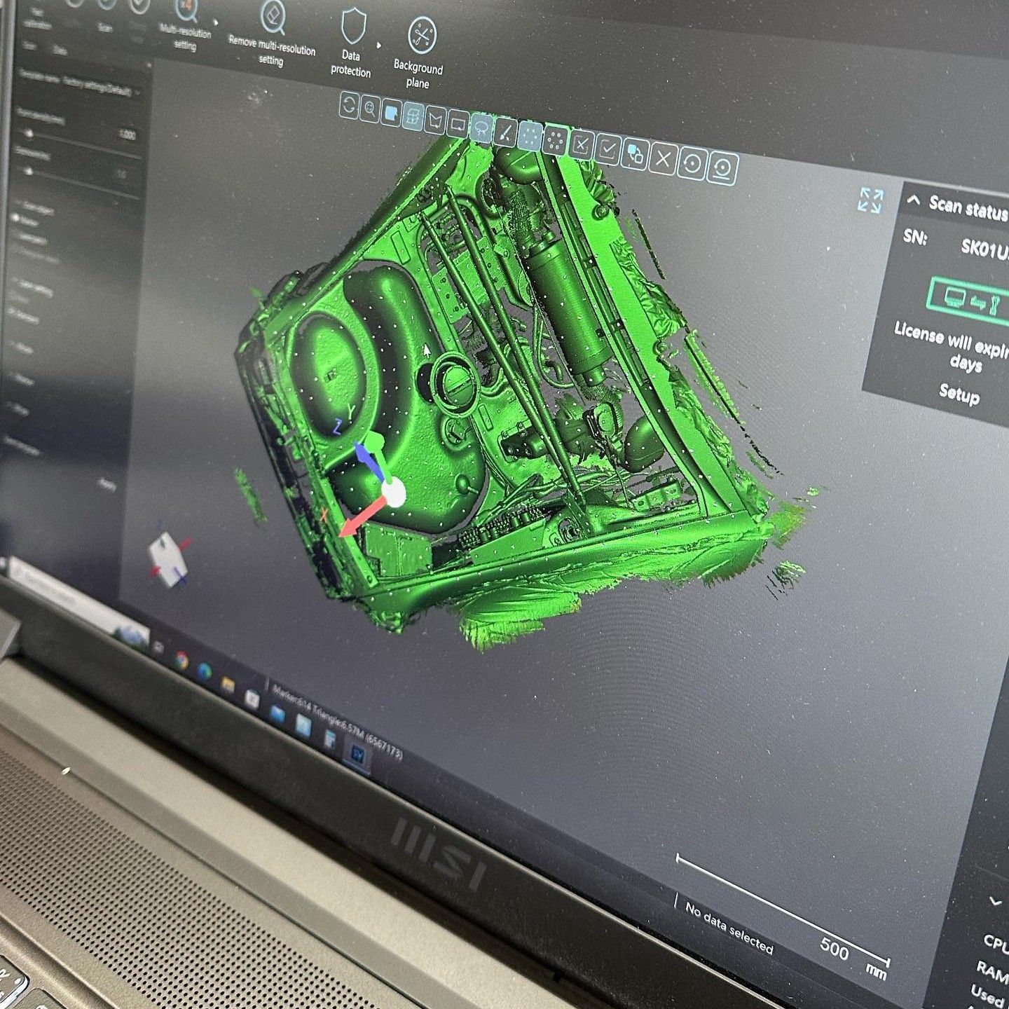 A msi laptop with a green drawing on the screen