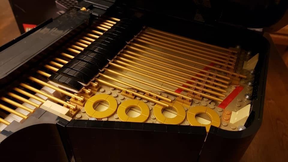 A close up of the inside of a piano made out of lego.