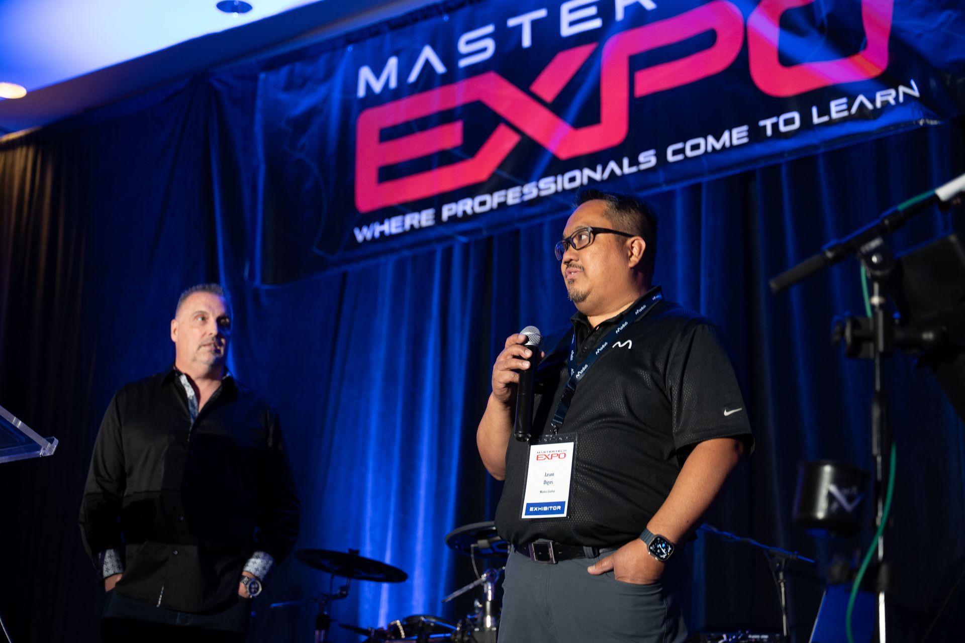 Two men on stage at a 