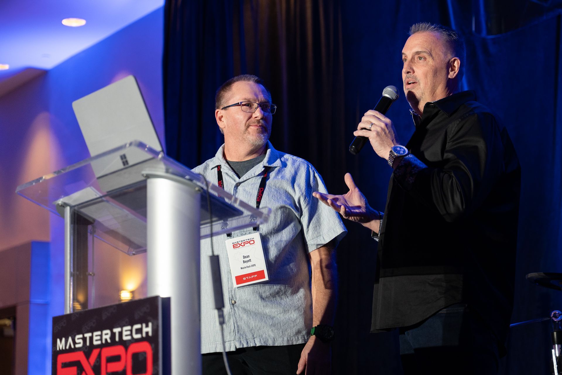 Two men at a podium at 