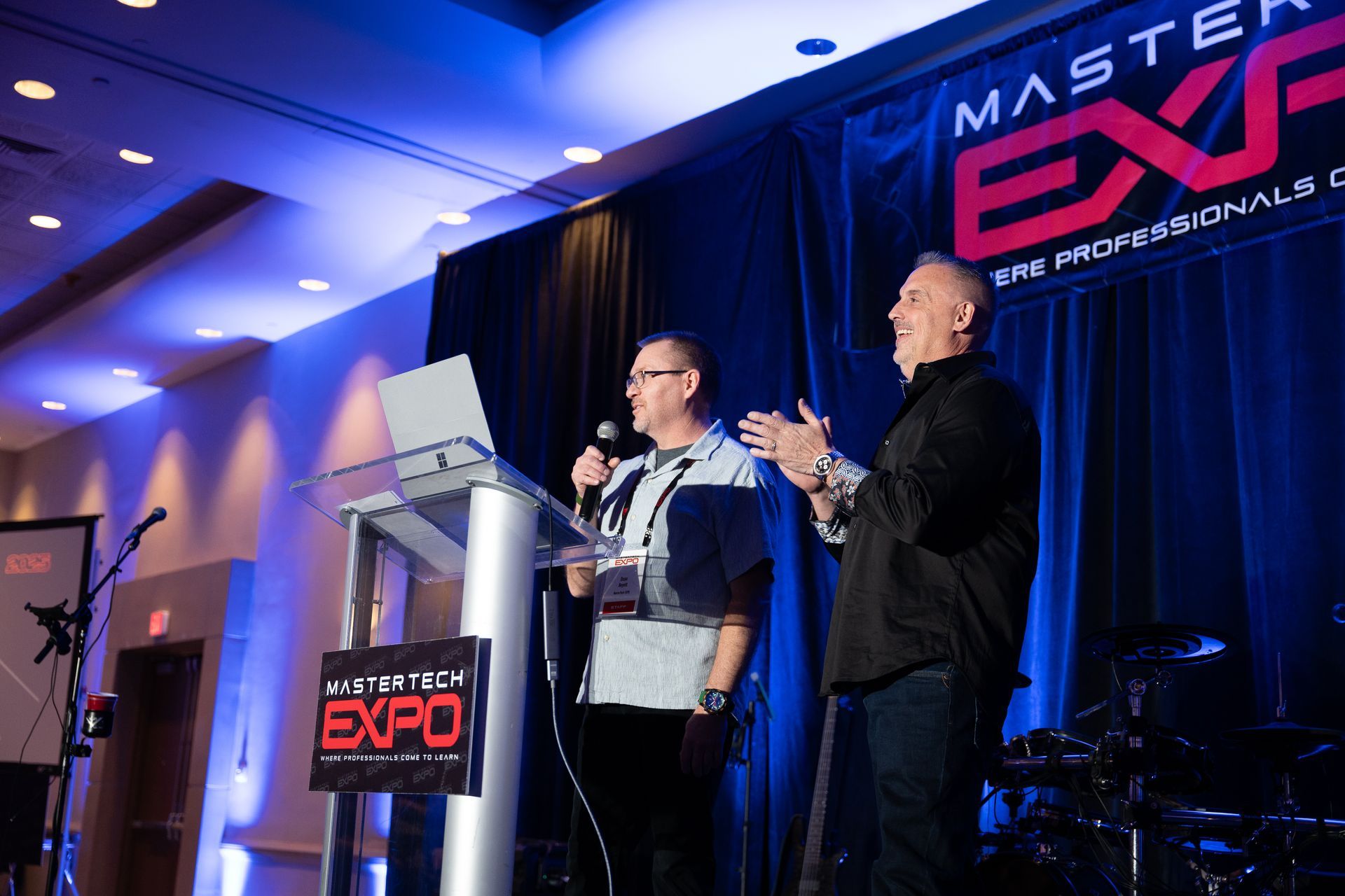 Two men on stage at a 