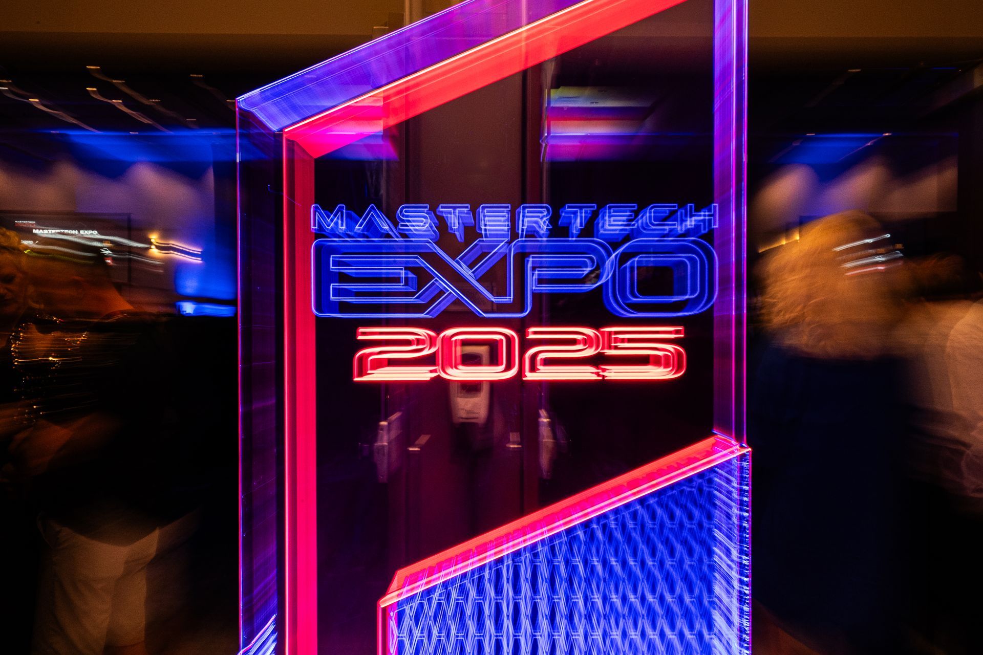 Neon sign for Expo 2025. Blue and red lights spell 