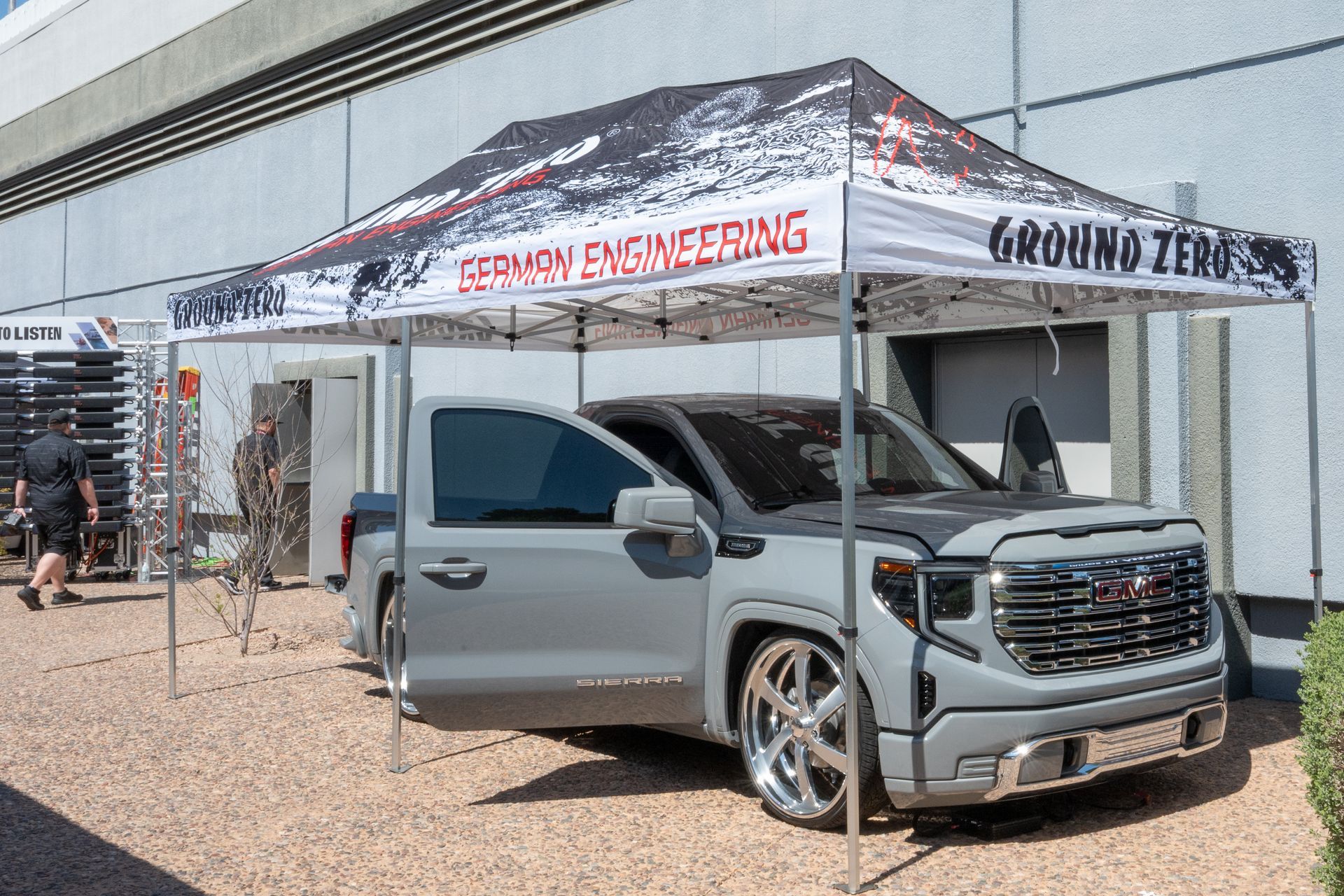 Gray pickup truck under a tent with 